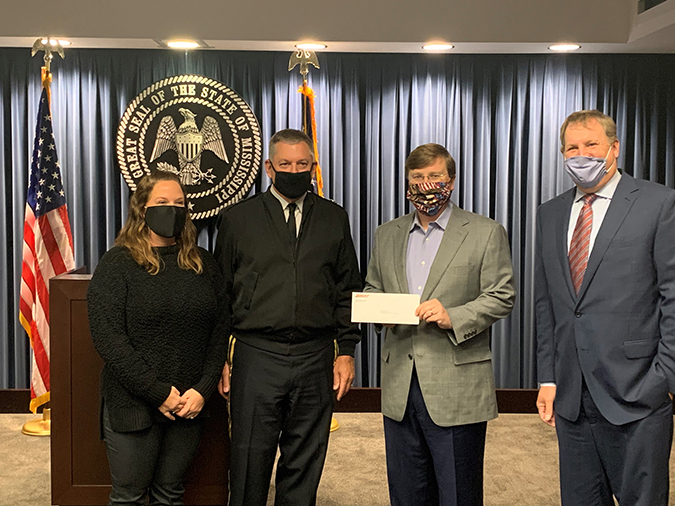 From left to right: Kristina Frazier, Family Support Programs and Mississippi National Guard; Mississippi Adjunct Gen. Janson Boyles; Mississippi Gov. Tate Reeves and BNSF’s Michael Garriga.